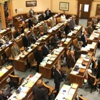 Wyoming Representatives stand in opposition to Senate File 115 in a vote count. The House killed the LGBT non-discrimination bill 33-26. (Gregory Nickerson/WyoFile)