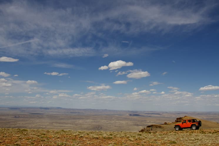 A Jeep driver explores the top of Aspen Mountain in Sweetwater County, Wyoming, where commissioners wrote a letter to lawmakers opposing transfer of federal lands to the state. Counties are lining up on both sides of the issue, which is spearheaded by the Utah-based American Lands Council nonprofit. (Flickr Creative Commons/Carfull)